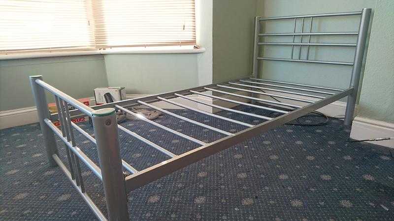 Single metal bed without mattress