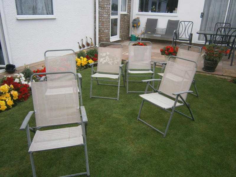 Six folding patio chairs
