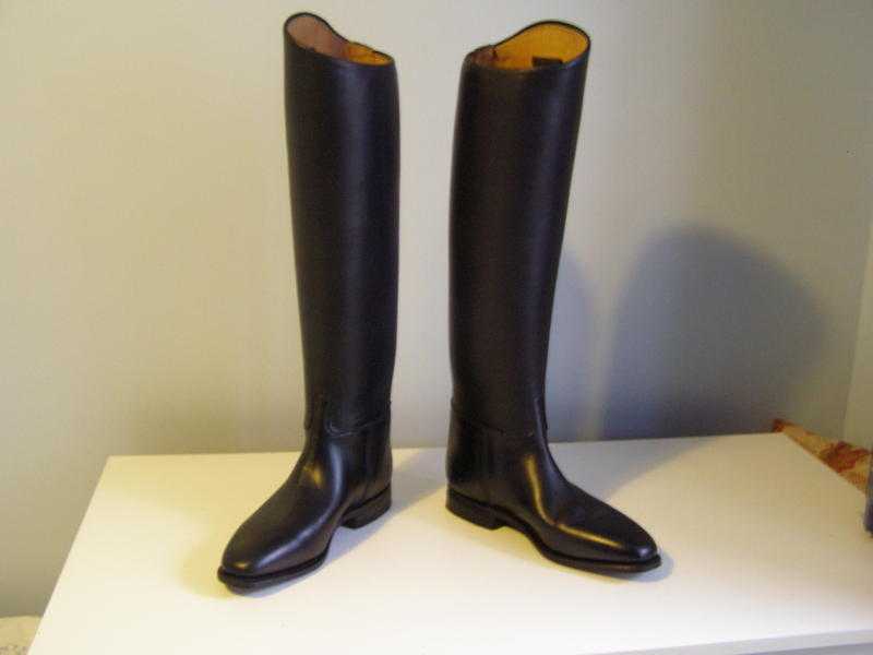 Size 5.5 Koenig Anja black leather riding boots with leather sole and rubber heels.