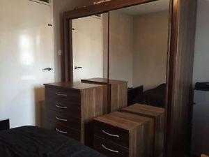 Sliding wardrobe, chest of drawers and bedside table