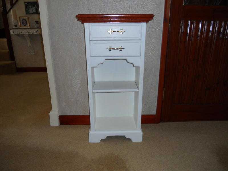 small white cabinet with glass top