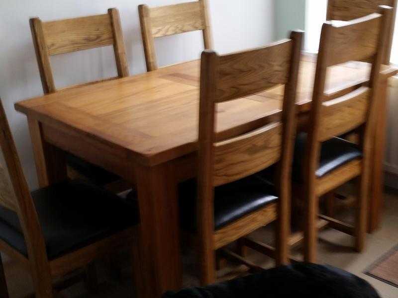 Solid oak dining table and 6 chairs