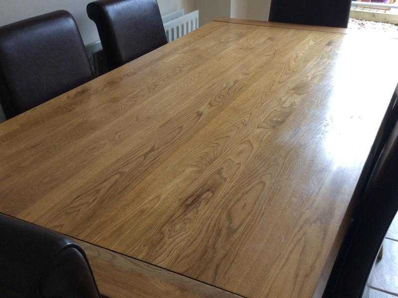 Solid oak dining table and 6 chairs