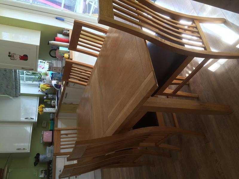 Solid oak dining table and 6 chairs for sale