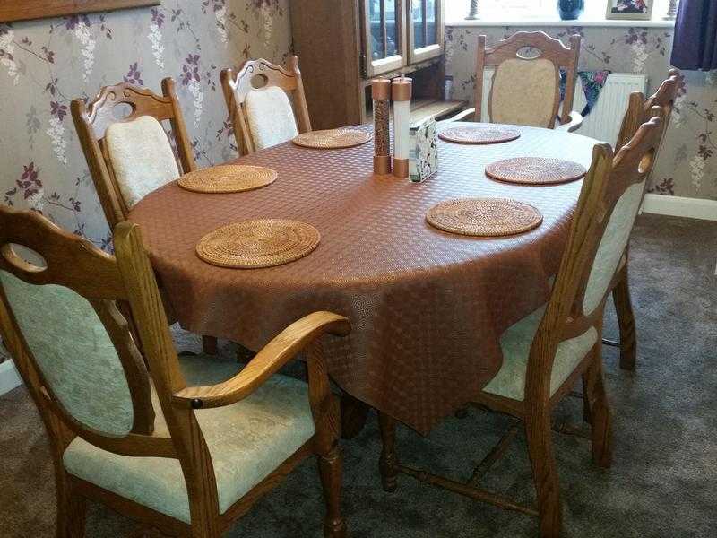 Solid Oak dining table and chairs.