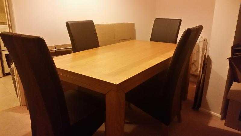 solid oak table and four chairs