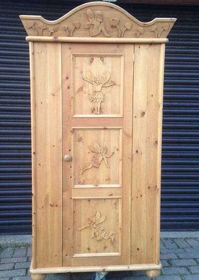 Solid pine single wardrobe with fairies carved into cornice and door