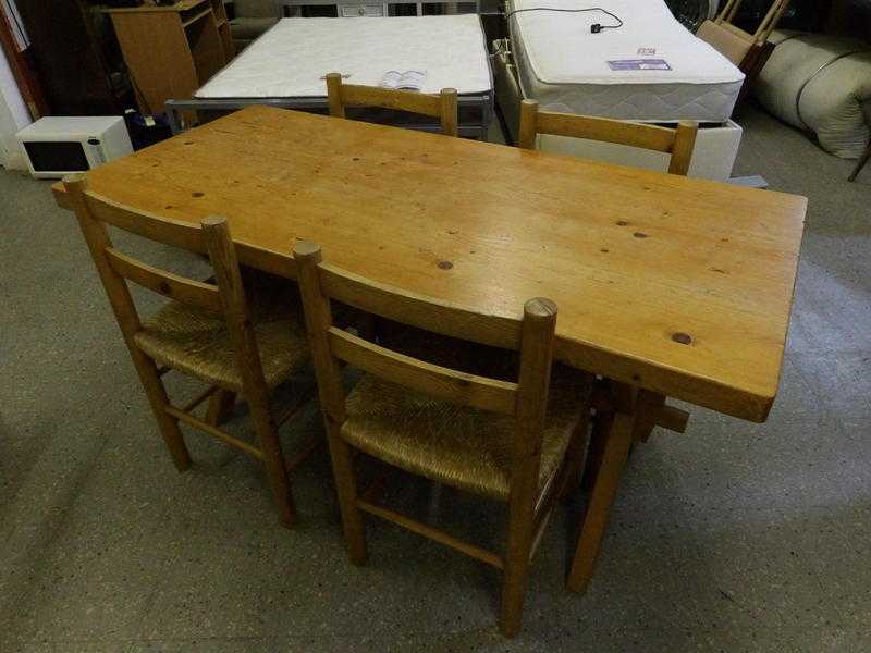 Solid pine table with 4 rush bottomed chairs in our 20 off sale