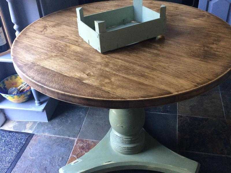 Solid round wooden table