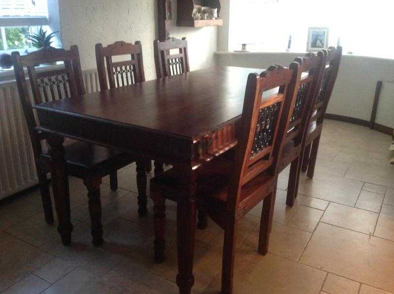 Solid wood dining table and 6 chairs with decorative backs