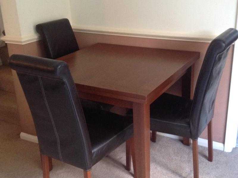 Solid wood dining table with matching chairs