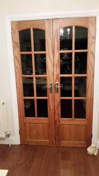 Solid Wood internal french doors with 8 glazed windows and chrome handles