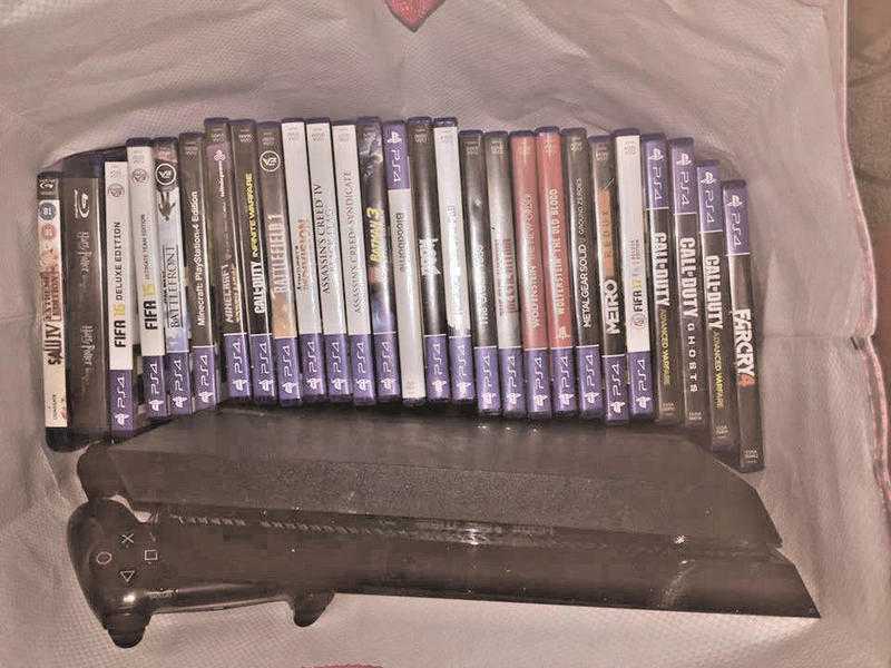 Sony PlayStation 4 - 25 games  2 movies and 2 controllers