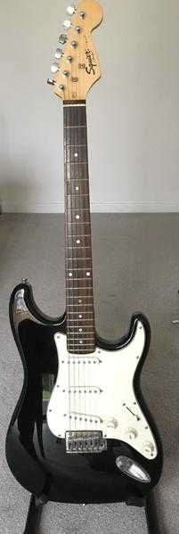 Squier Strat Guitar by Fender ,accessories and amp