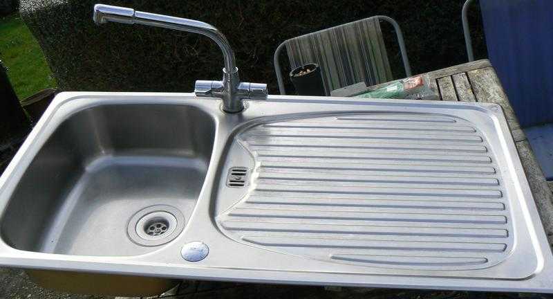 Stainless steel sink unit with mixer taps