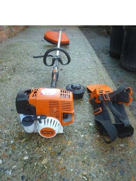 Stihl petrol strimmer near mint cond only 2 years old  (sells now for 370 without harness amp hat)