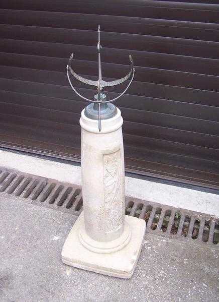 Stone and Brass Sundial Garden Ornament.