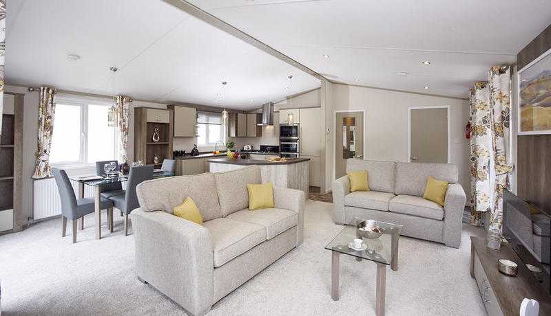 Stunning Lodge for sale with full wrap around deck open 12 months on northumberland coast