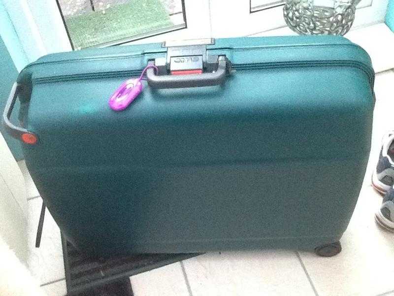 Suitcases (2), green plastic on wheels