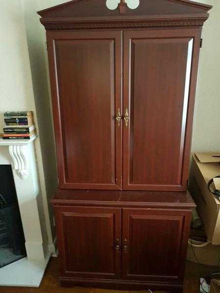 Tall wooden armoirecupboard