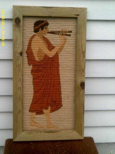 Tapestry picture of Roman man playing flute