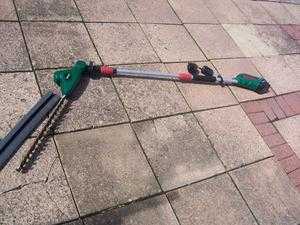 Telescopic hedge trimmer once used