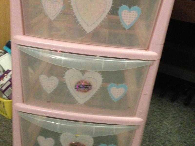 Three drawer pink storage unit on wheels