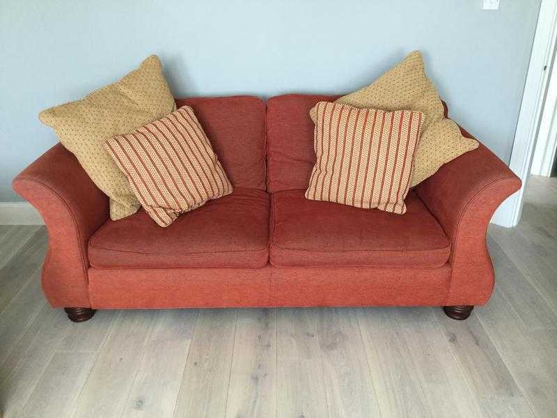 Three seater, rust red colour sofa