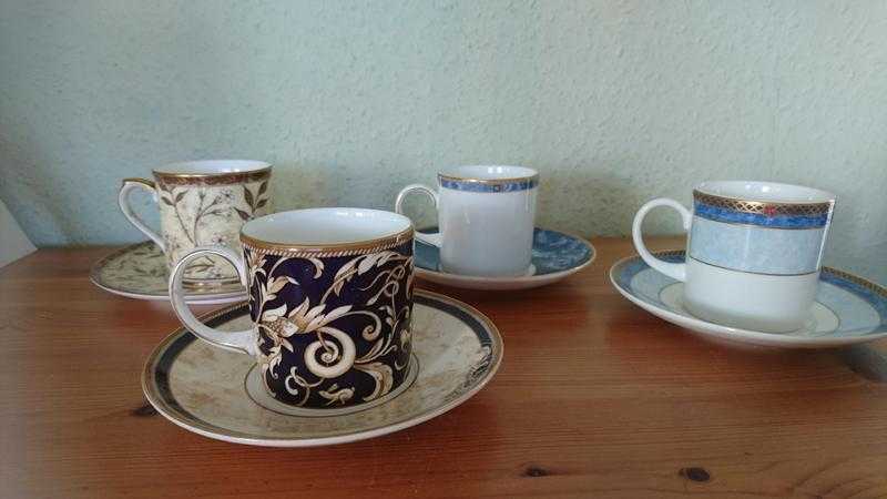 Three Wedgwood cups and saucers and one. Victoria and Albert cup and saucer