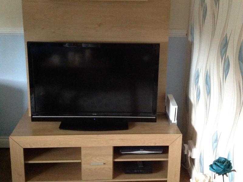 Tv unit in teak shelves and drawer side shelves for DVDs in very good condition 60 pounds or nearest