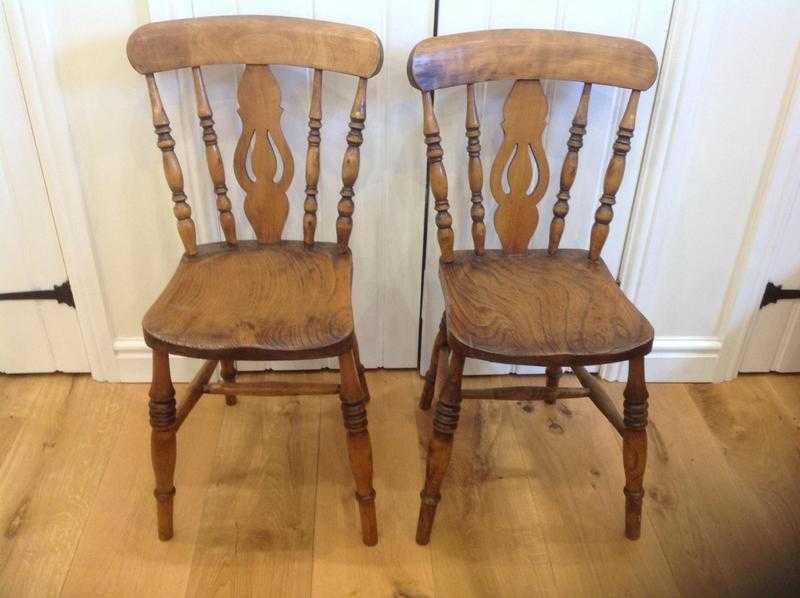 Two Antique oak dining chairs.