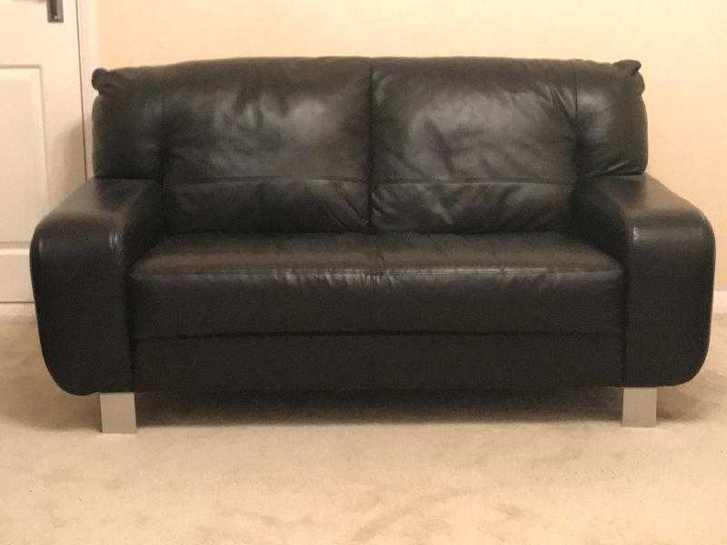 Two black leather sofas, one two seater and one three seater for sale.