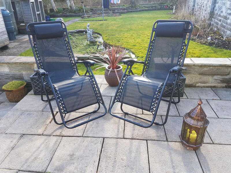 Two Black Reclining Sun Loungers