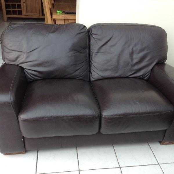 Two brown leather sofas