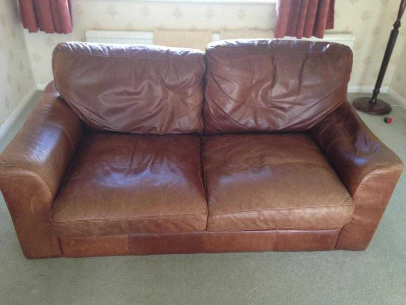 Two brown leather sofas