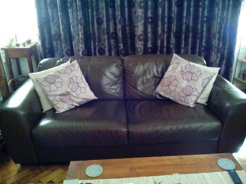 Two Brown Leather Sofas