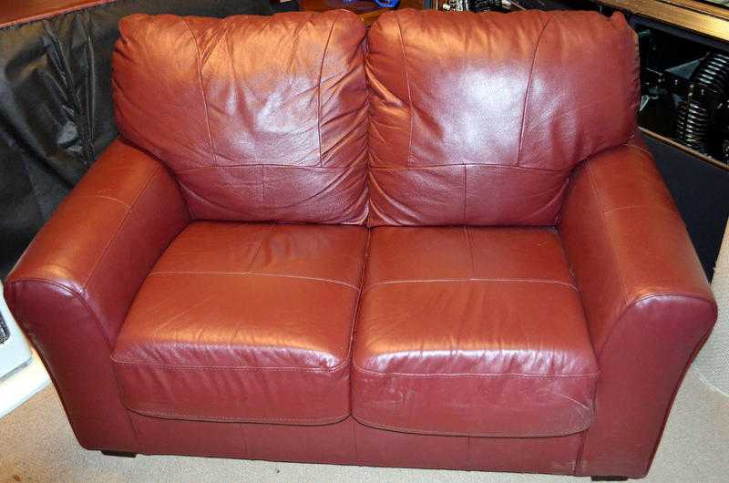 TWO BURGUNDY LEATHER SETTEES