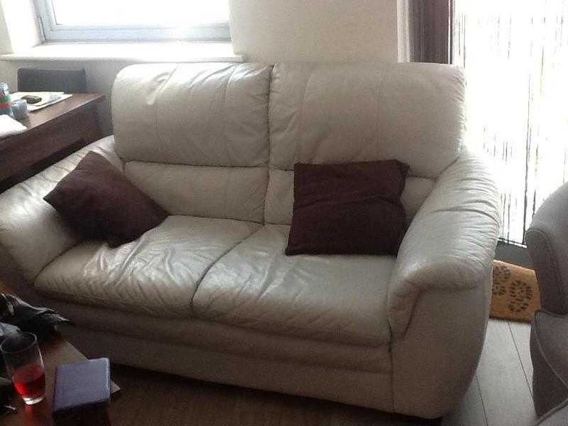 Two cream 2-seater sofas 100