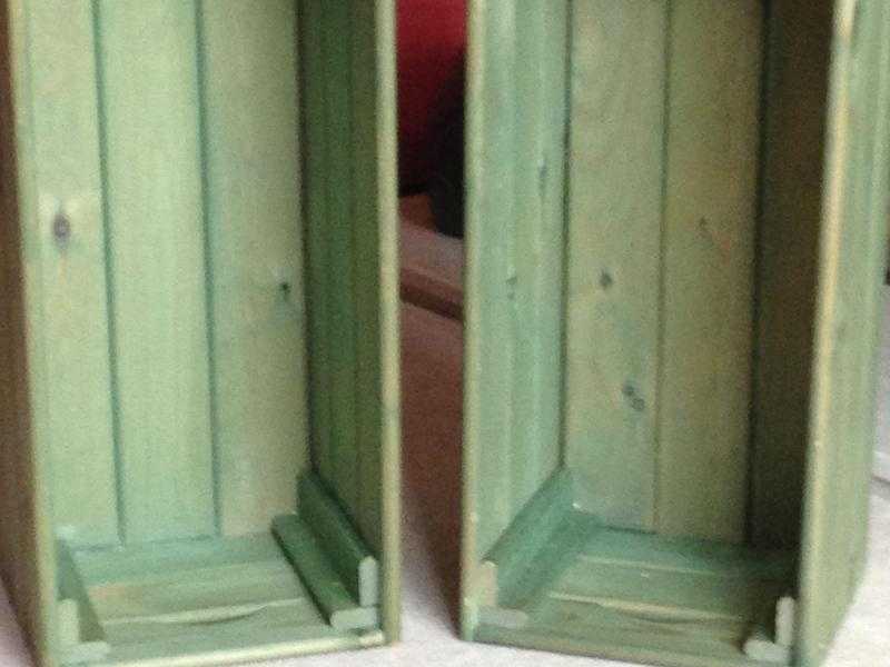 Two green wooden storage boxes