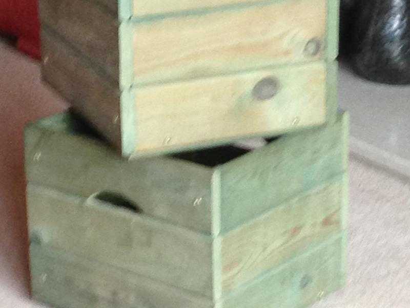 Two green wooden storage boxes