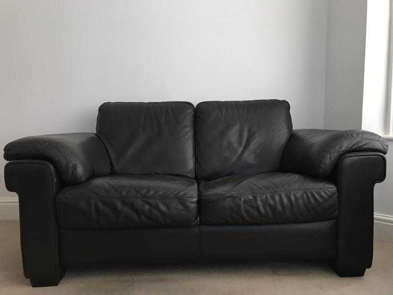 Two leather 2 seater sofas amp footstool