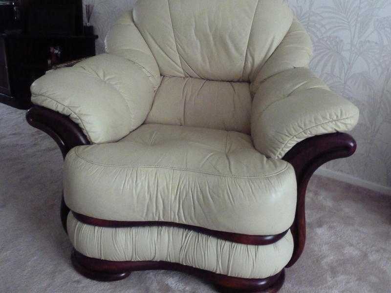 Two leather armchairs and a footstool