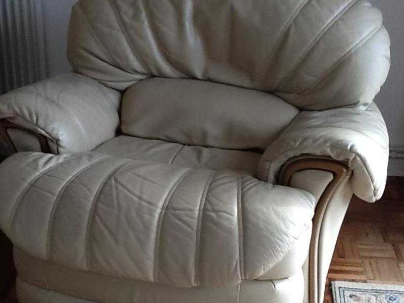 TWO LEATHER SWIVEL RECLINING ARM CHAIRS