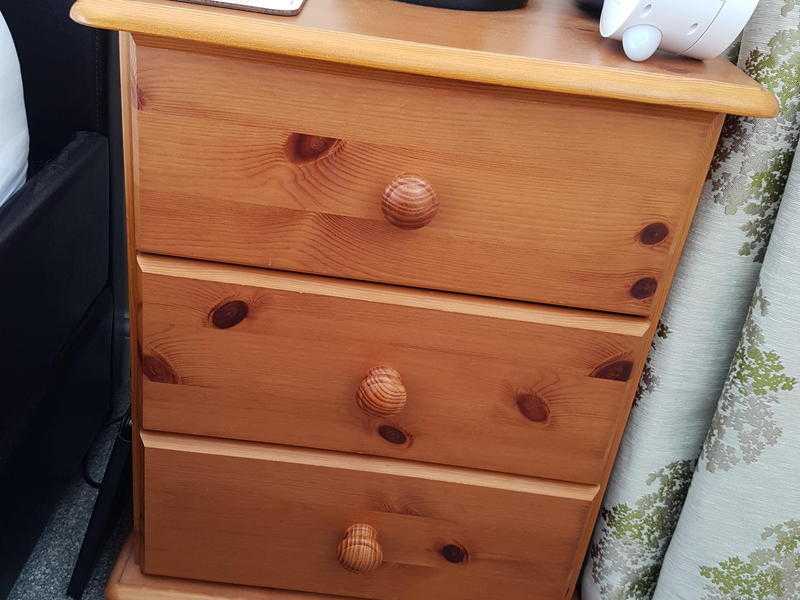 Two matching bedside cabinets in solid pine.