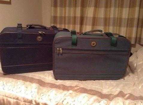 TWO MATCHING SUITCASES