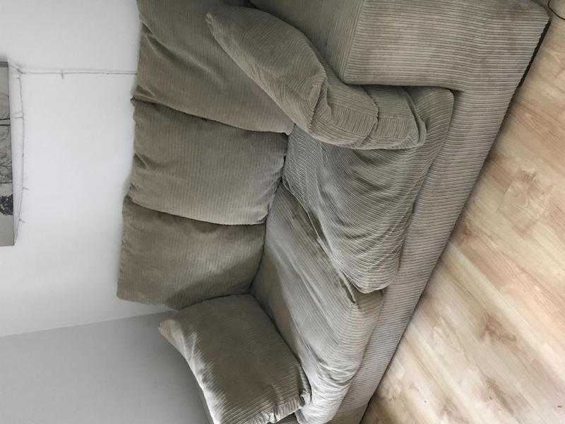 Two seater beige sofa