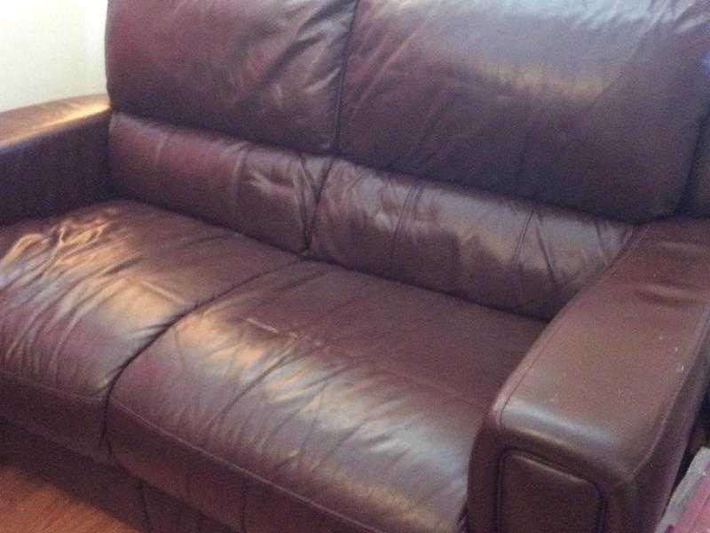 Two seater brown leather sofa