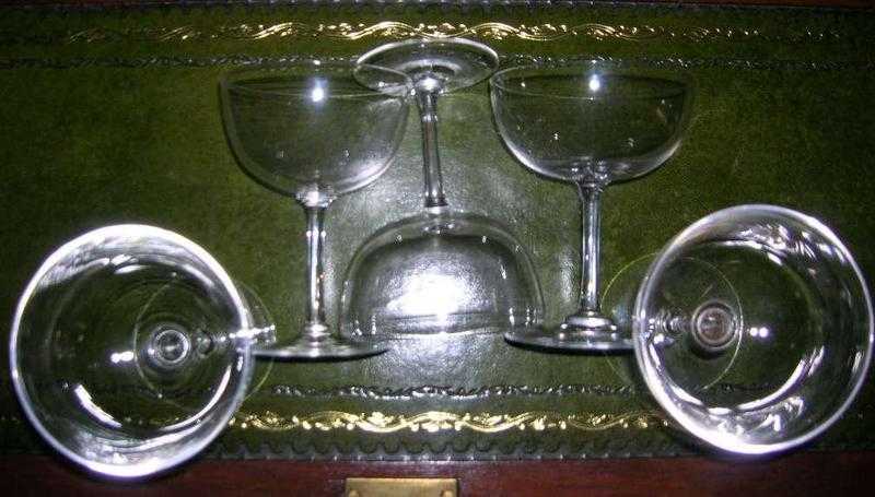 Two sets of old glasses - champagne and liqueur