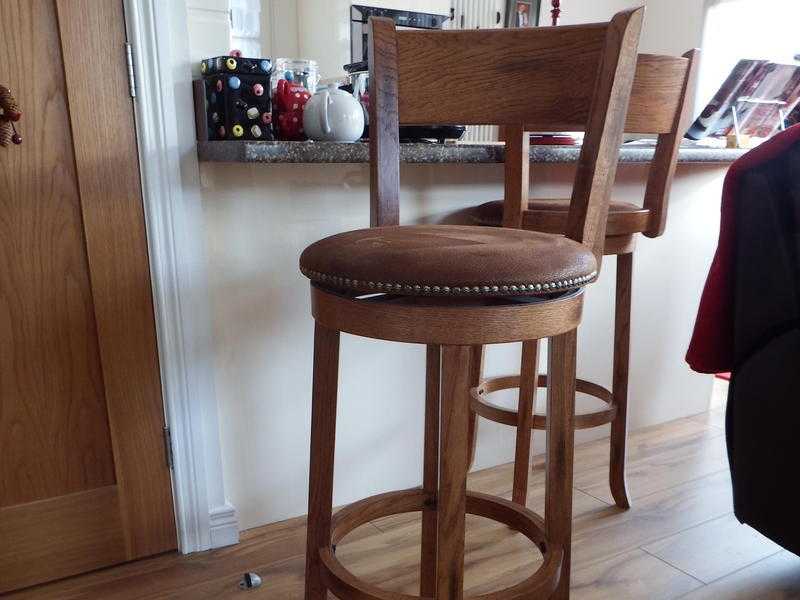 Two wooden bar stools