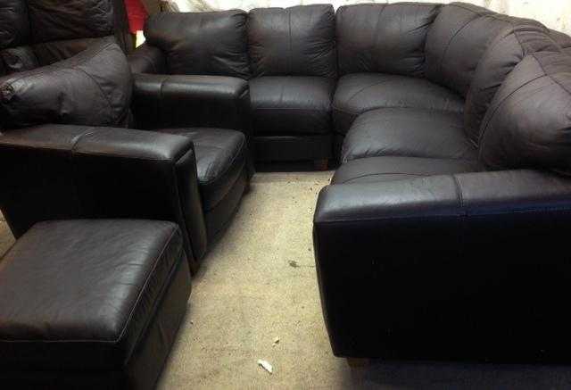 very good condition dark Brown leather corner sofa and matching chairs and footstool with storage